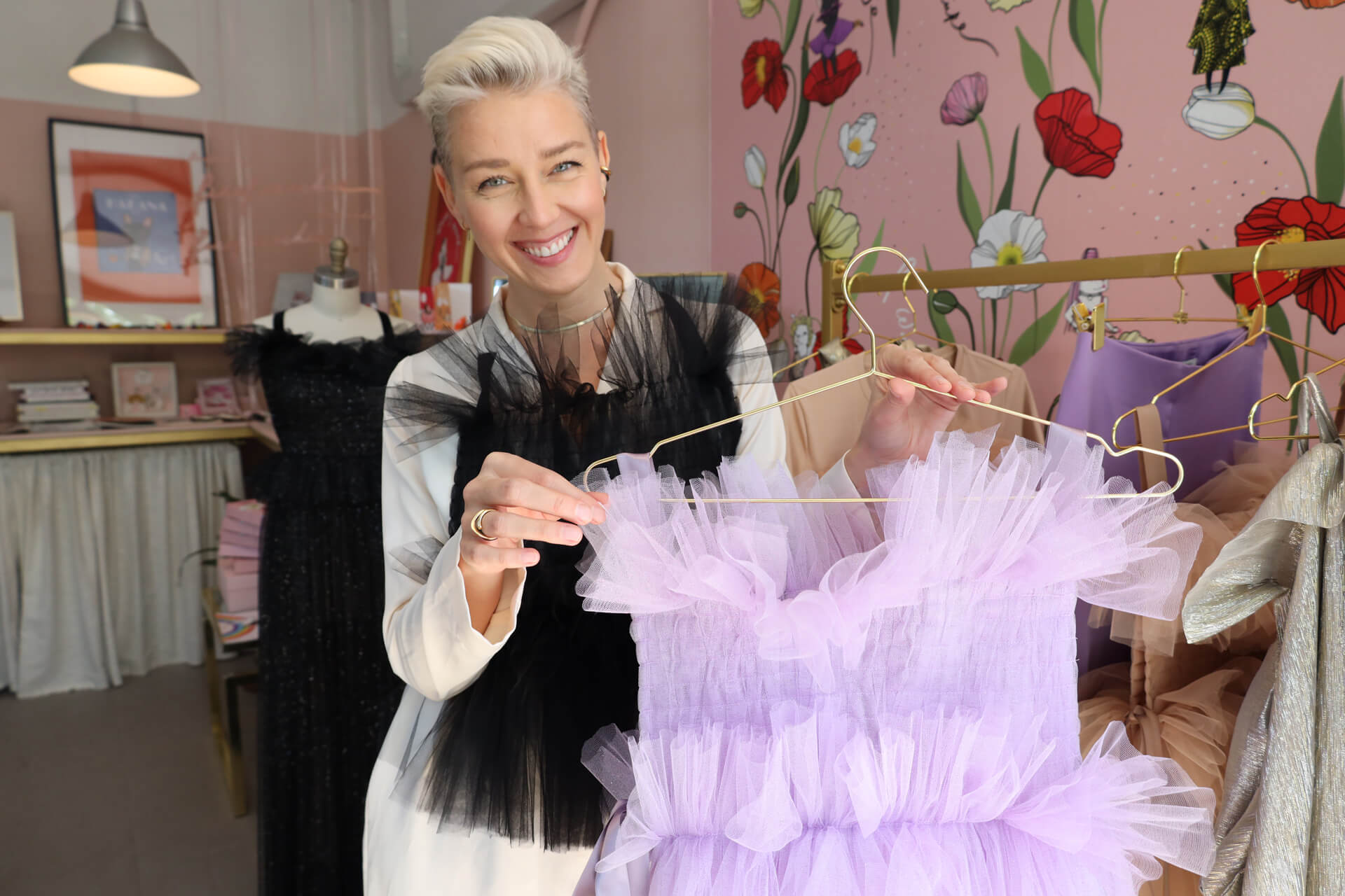 Valeria Krasavina holding up dress